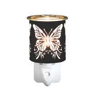 A black plug-in electric wax melt warmer with a butterfly pattern cutout emits a warm glow. The elegant design creates a serene, delicate atmosphere.