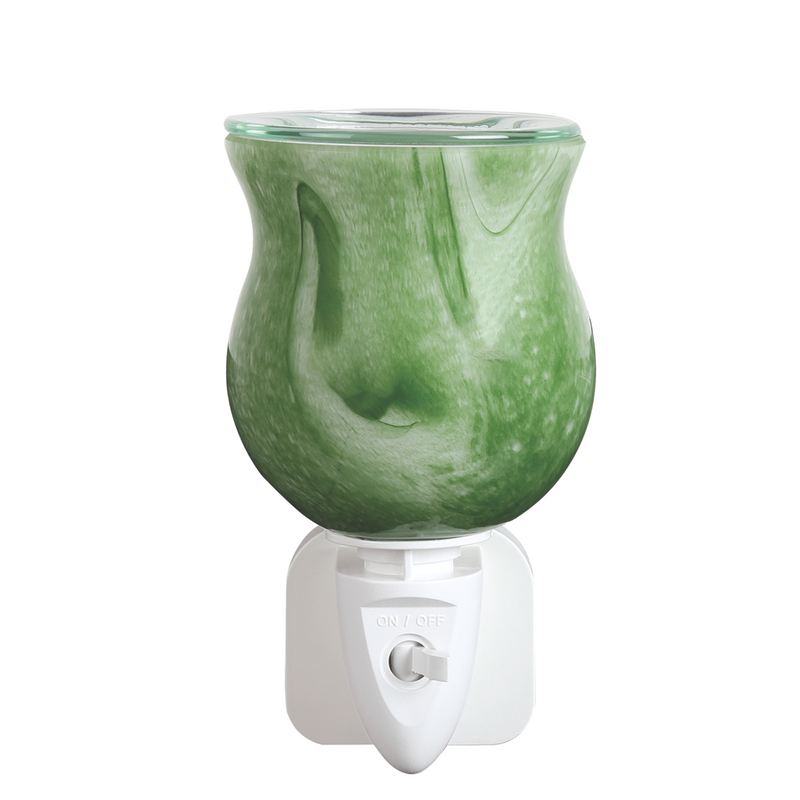 A green-colored, vase-shaped electric wax melt warmer on a white plug-in base. It has an on/off switch and a textured, swirled pattern.