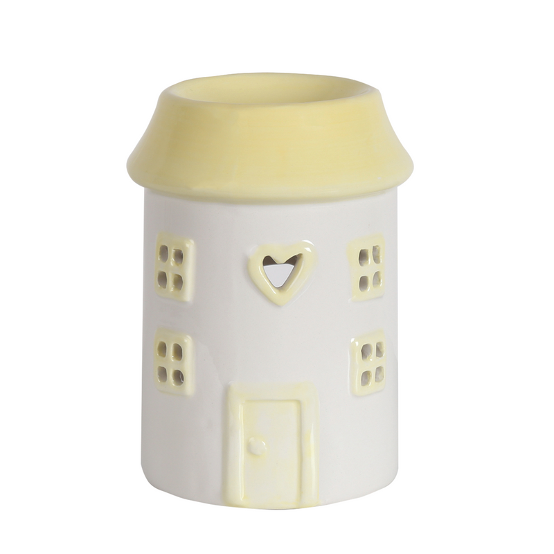 Ceramic wax melt warmer shaped like a cream house. Features include square windows, a heart-shaped cutout, and a front door design.