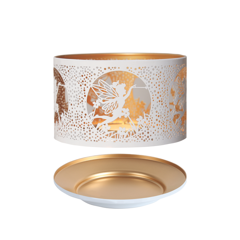 Decorative candle shade with intricate white cutout design of fairies and flowers. Gold interior and a matching gold plate base, creating an elegant tone.