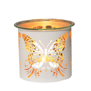 A glowing wax melt warmer with a butterfly cutout design, casting warm, intricate shadows. The white exterior contrasts with the cozy orange light inside.
