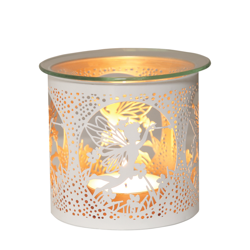 A decorative candle holder with a lit candle inside. It features intricate fairy-themed cutouts, casting warm, whimsical shadows.