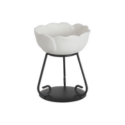 Elegant white ceramic wax melt bowl with scalloped edges on a black metal stand. The modern design conveys simplicity and sophistication.