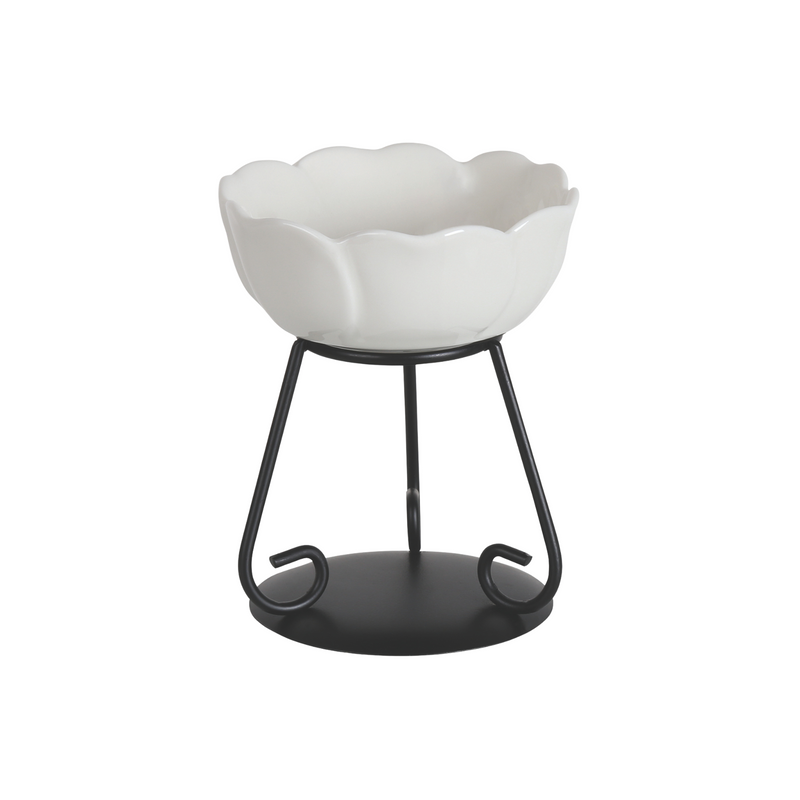 Elegant white ceramic wax melt bowl with scalloped edges on a black metal stand. The modern design conveys simplicity and sophistication.