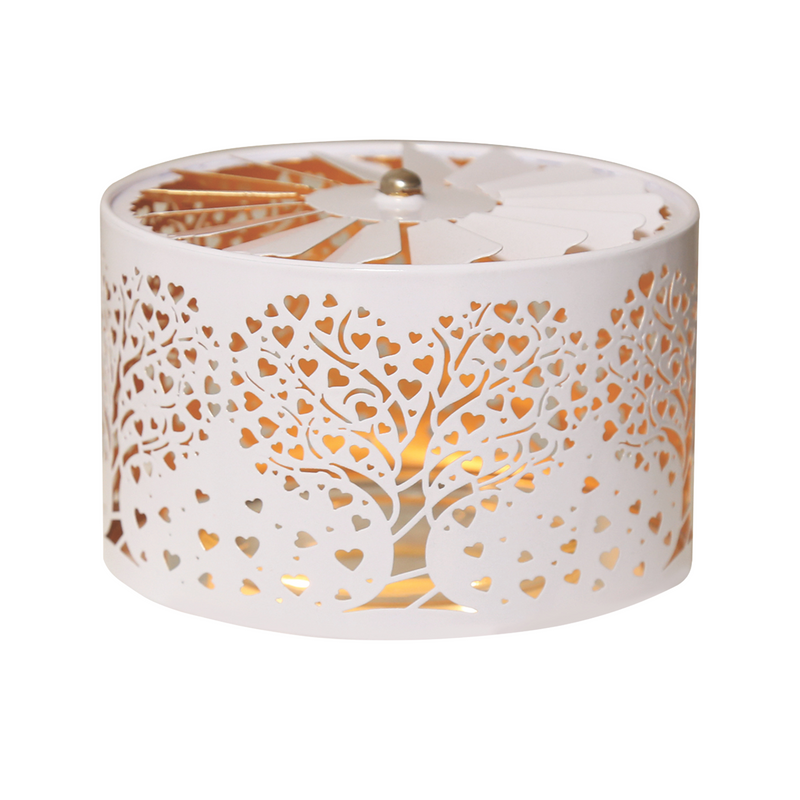 Elegant white cylindrical candle jar spinning shade carousel with intricate  heart and tree cutouts. Warm light glows through the designs, creating a serene and decorative ambiance.