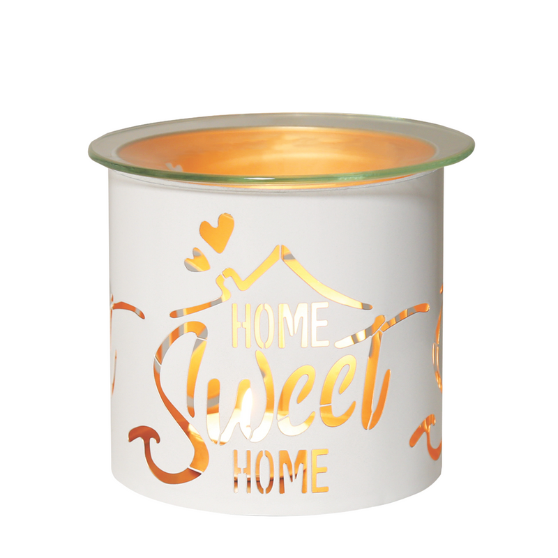 White candle holder and wax melt warmer  with  a gold inner and cut-out letters reading "Home Sweet Home" and hearts, glowing warmly, creating a cozy and welcoming atmosphere.