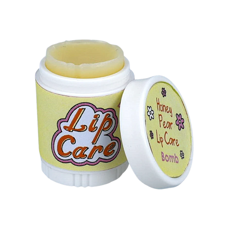 Lip care product in a container featuring a twist-off cap. The container is predominantly yellow with the words "Lip Care" in bold, colorful lettering on the front. The cap is slightly open, revealing a pale yellow lip balm inside. Next to it, a smaller lid displays the text "Honey Pear Lip Care Bomb" along with a floral design. The overall design suggests a playful and soothing lip care product.