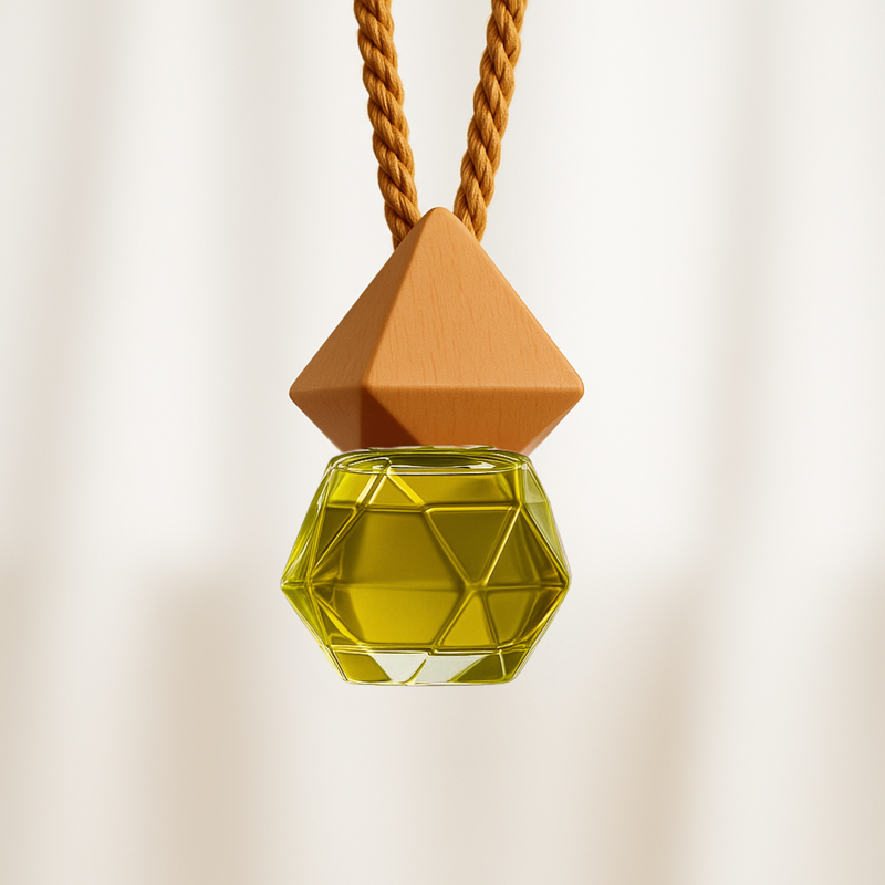 Geometric Car Fragrance Diffuser with yellow-colored, hexagonal bottle, suspended from a brown twisted cord. Minimalist and elegant design.