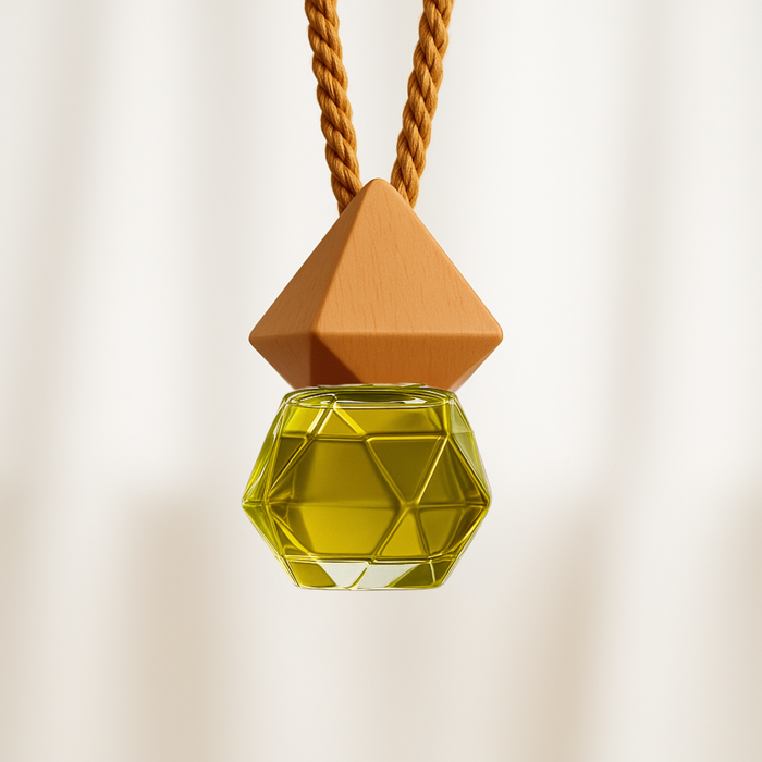 Geometric Car Fragrance Diffuser with yellow-colored, hexagonal bottle, suspended from a brown twisted cord. Minimalist and elegant design.