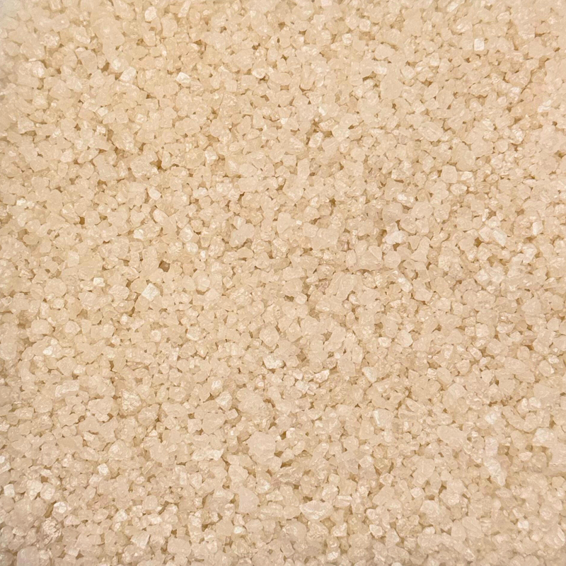 Close-up of white fragrance scent sizzlers, filling the entire frame. The texture is crystalline, conveying a raw and natural feel.