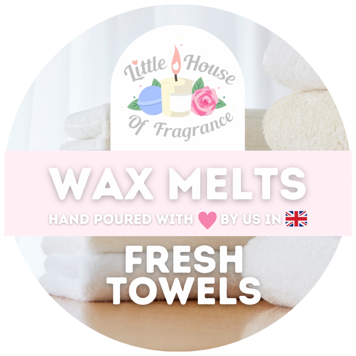 Label for "Little House of Fragrance" wax melts. Features pastel colors, folded towels, and text: "Wax Melts: Fresh Towels." Cozy, clean vibe.