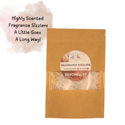 Brown kraft bag labeled "Fragrance Sizzlers Seychelles" with visible white crystals, highlighting "Highly Scented, A Little Goes A Long Way!" on a cloud backdrop.