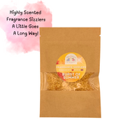Brown paper bag containing "Burst of Summer" fragrance sizzlers with a colorful label. Text reads "Highly Scented, A Little Goes A Long Way!" on pink watercolor background.