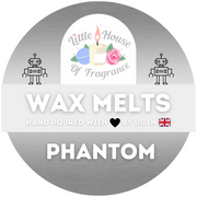 Circular label with metallic background featuring a logo of a candle and rose, flanked by two robots. Text reads "Wax Melts" and "Phantom," with a heart and UK flag.