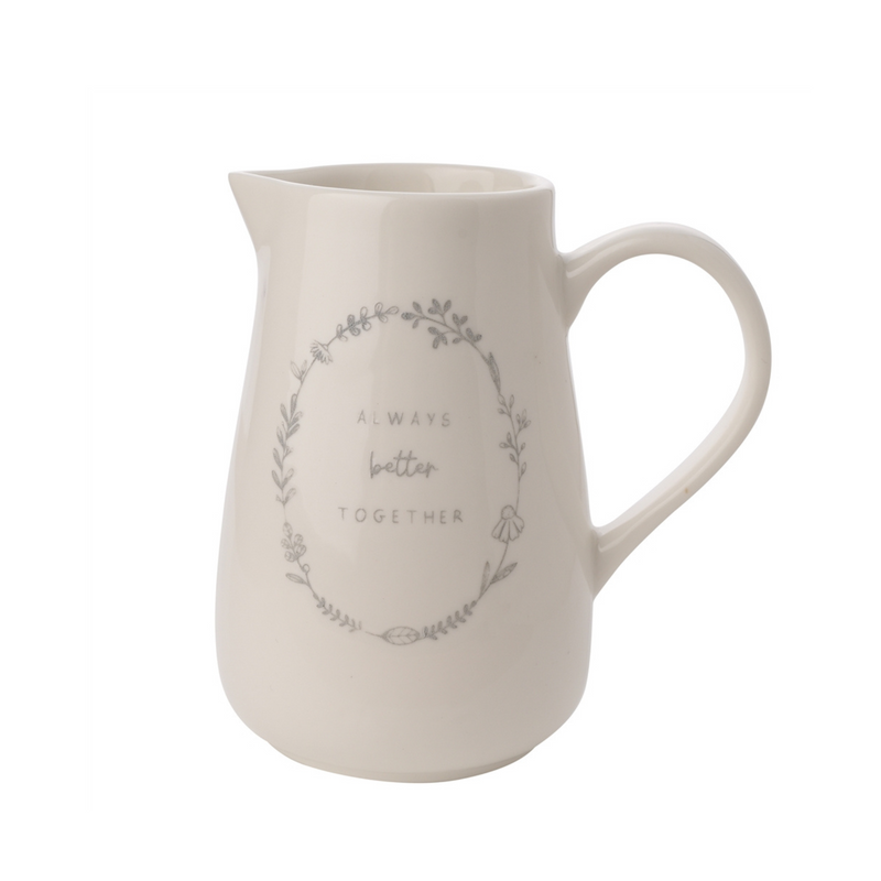 Off white colored ceramic jug with an elegant floral wreath pattern and the words "Always better together" in the center. Simple and heartfelt.