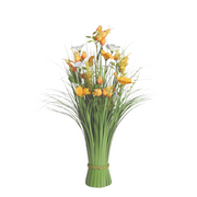 A vibrant floral arrangement with orange and white flowers among lush green leaves and grass, tied at the base. The tone is fresh and lively.
