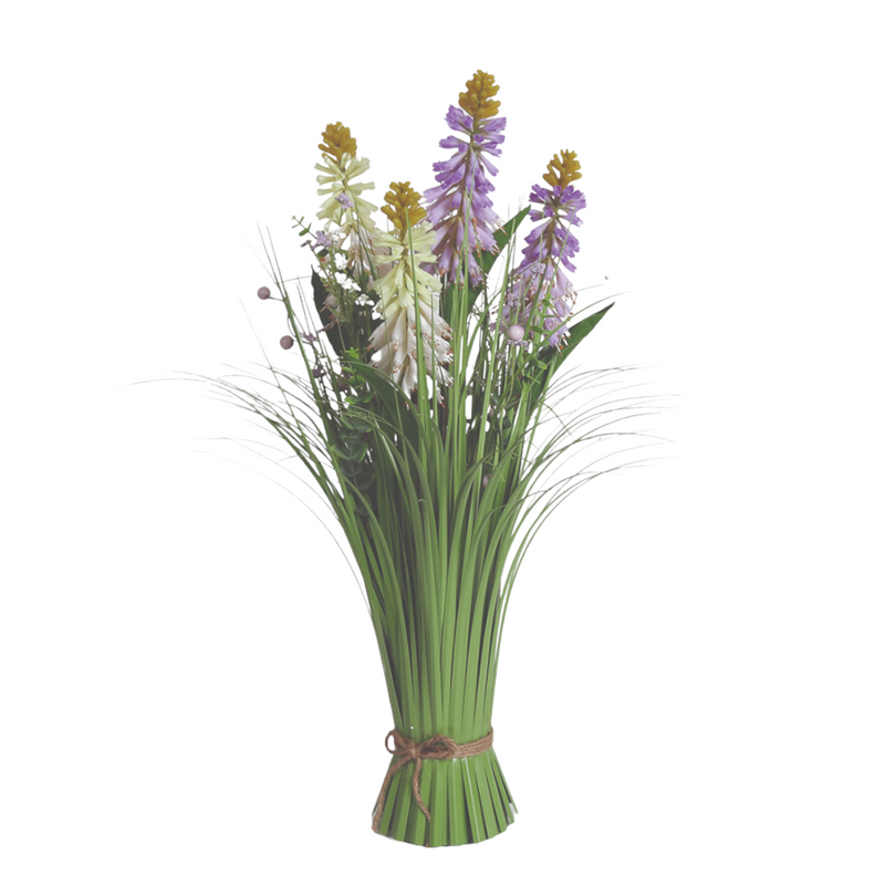 A bouquet of green grass-like leaves with three cone-shaped flowers, featuring purple, white, and yellow hues, tied with a brown rope. Bright and fresh tone.