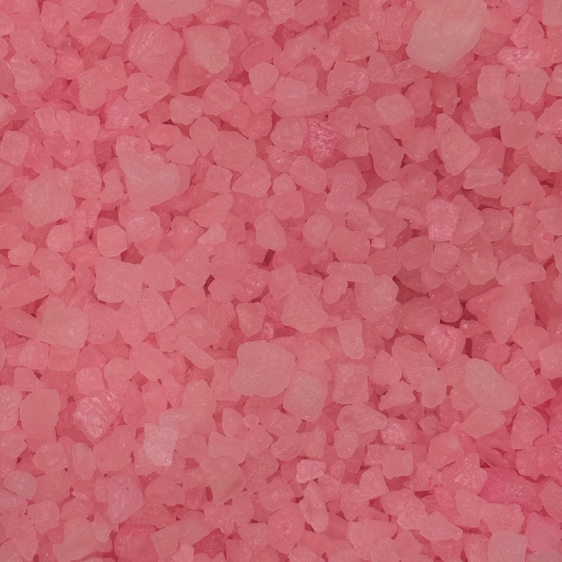 Pink fragrance sizzlers crystals close up showing salt based biodegradable granules
